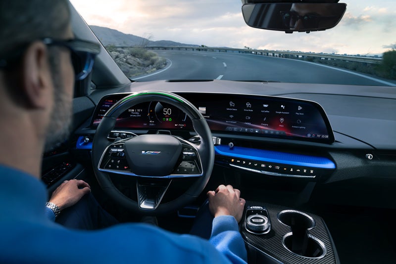 Front View of the 2026 OPTIQ-V Driving Through the Dusk Utilizing its Headlights | Taylor Motors in Redding CA